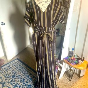 Jumpsuit. Long. Lined inside. Fitted with ties